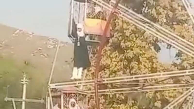 Moment screaming girl dangles from Ferris wheel after she loses footing on ride