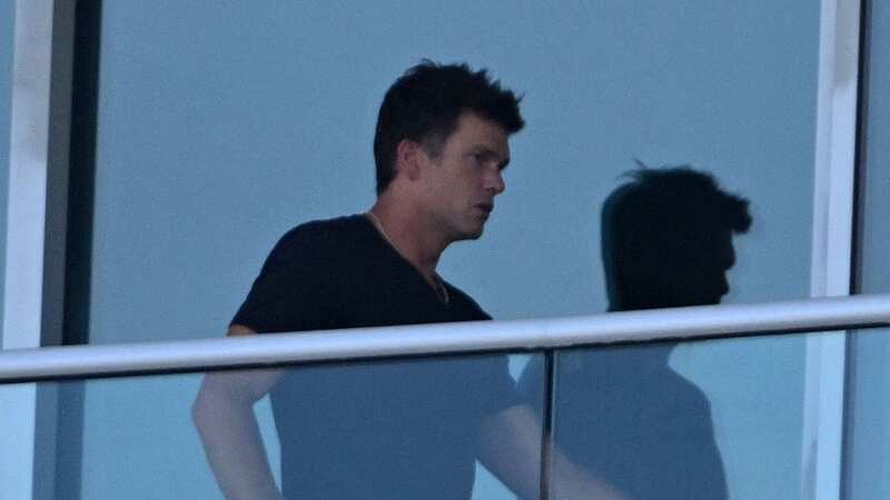 Tom Brady pictured chilling on his Miami balcony while Irina Shayk is in Venice (Image: MEGA)