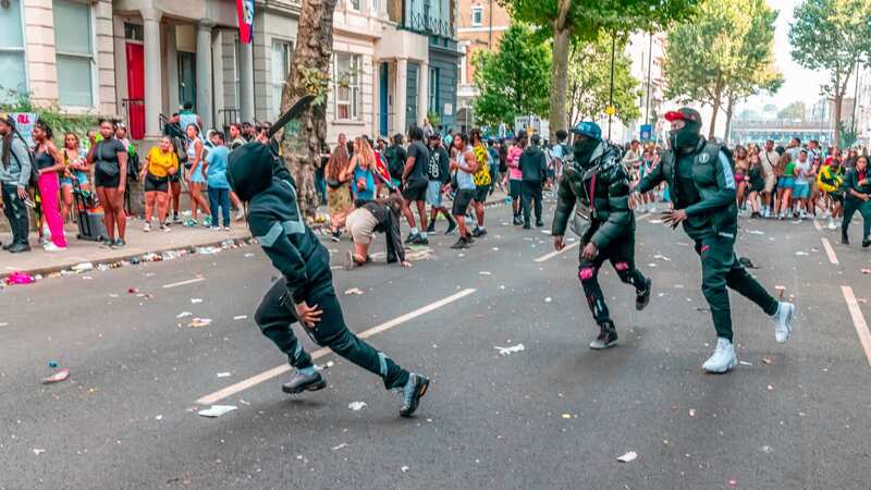 Moment Notting Hill carnival crowds flee in terror from machete-wielding thug