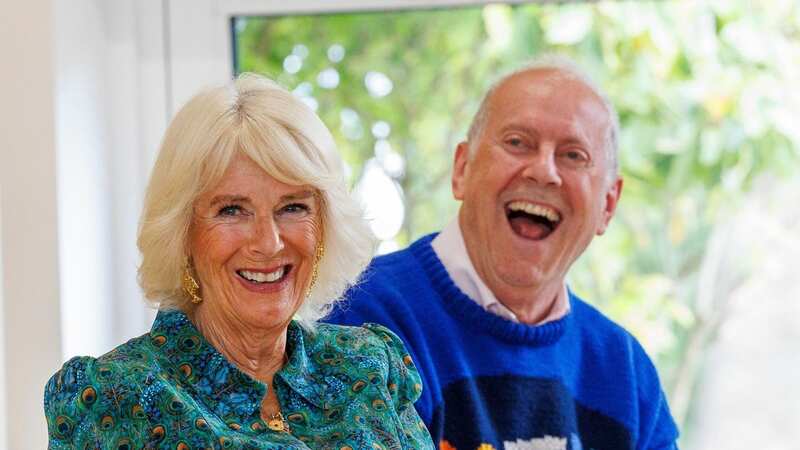 Organiser Gyles Brandreth and Queen Camilla were moved by the family (Image: Doug Seeburg/WPA Pool/REX/Shutterstock)