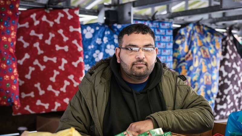Umair Hussain, a stall holder at Hyde Market, Greater Manchester, who says yobs have been plaguing the town centre (Image: MEN Media)
