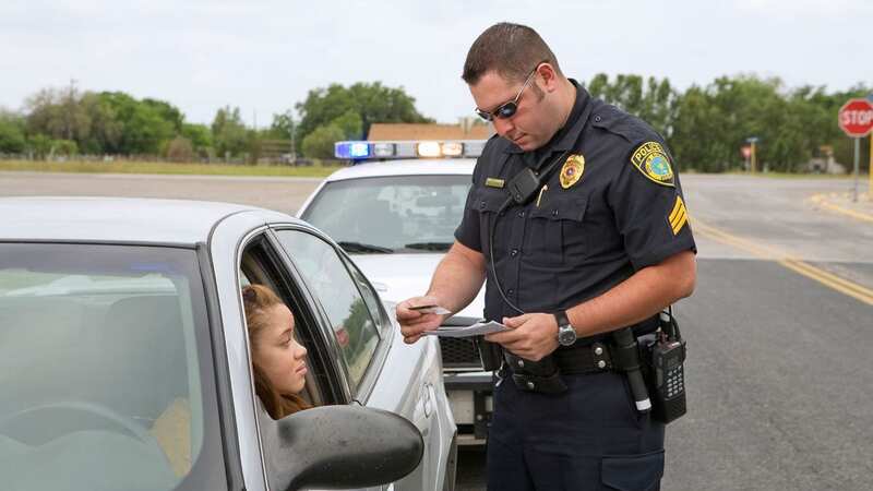 Police officers in the US always touch the back of your car when they pull you over (stock photo) (Image: Getty Images)