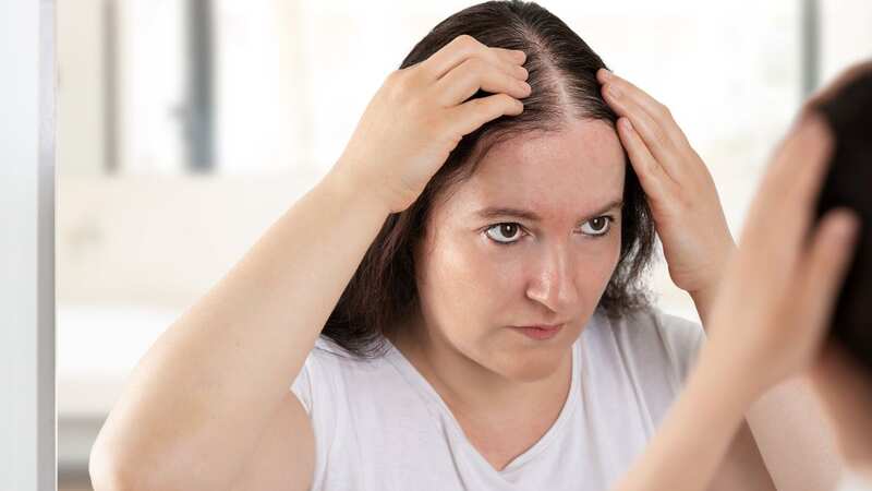 When hair starts coming out in large amounts it can be hugely distressing. (Image: Getty Images/iStockphoto)