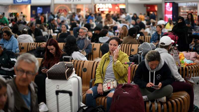 Passengers delayed at Stansted Airport last week (Image: AFP via Getty Images)
