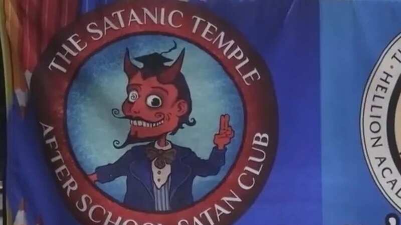 Dozens of people protested against an event hosted by the Satanic Temple