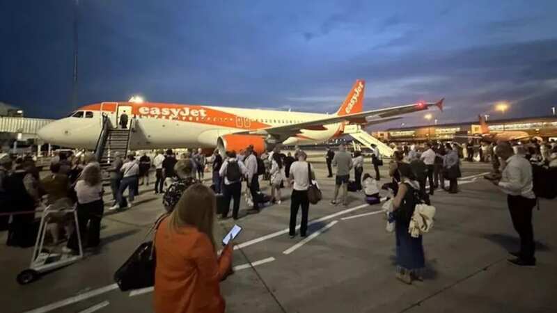 Passengers waiting to re-board the plane at Birmingham (Image: Birmingham Live WS)