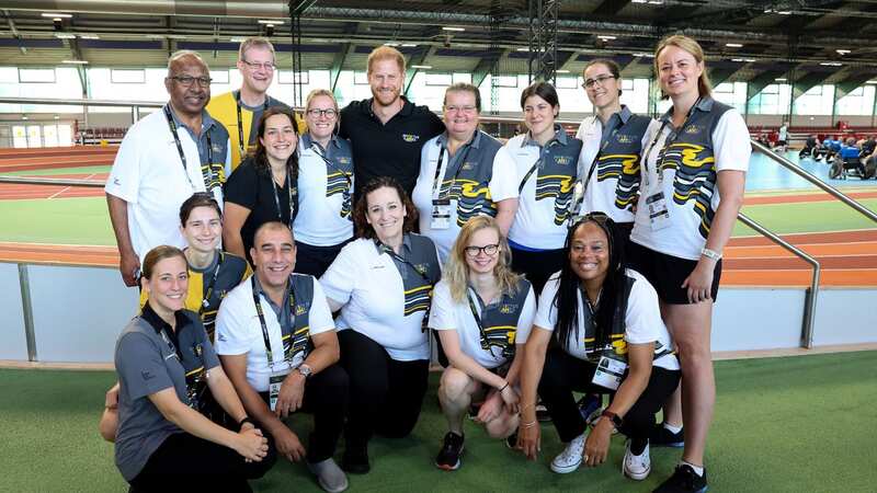 Prince Harry smiles joining volunteers ahead of Invictus games without Meghan