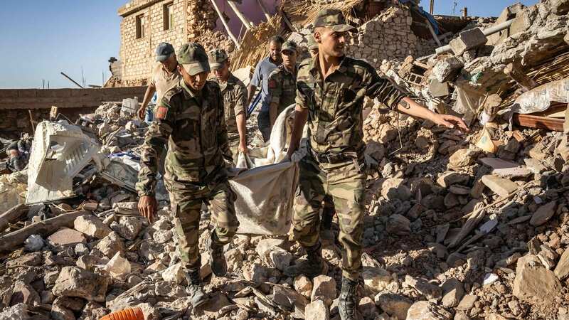 Moroccan Royal Armed Forces evacuate a body from a house destroyed in an earthquake (Image: AFP via Getty Images)