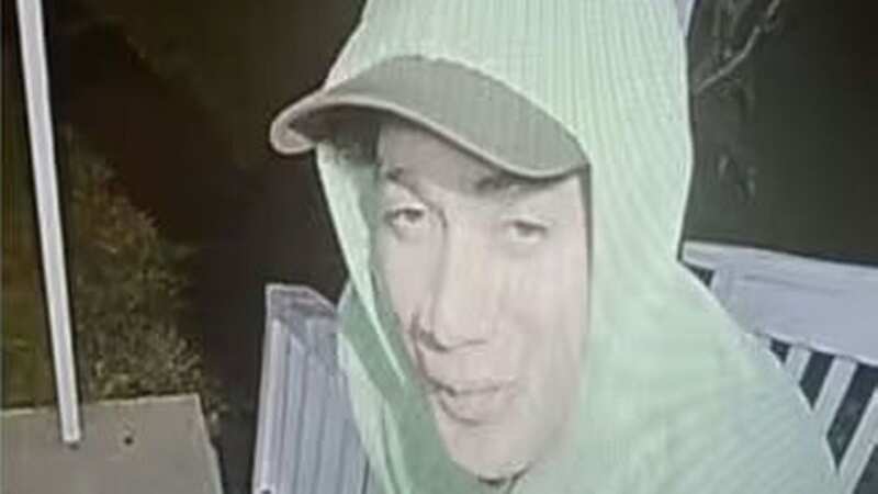 Danelo Cavalcante, 34, smiling at a camera outside a home (Image: U.S. Marshals Service Philadelphia)