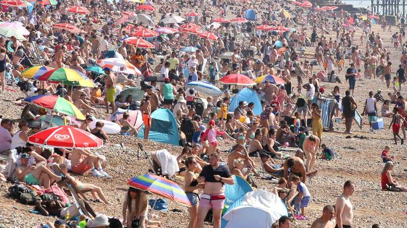 Beachgoers in Brighton on Saturday enjoy the unprecedented September hot spell (Image: Anadolu Agency via Getty Images)