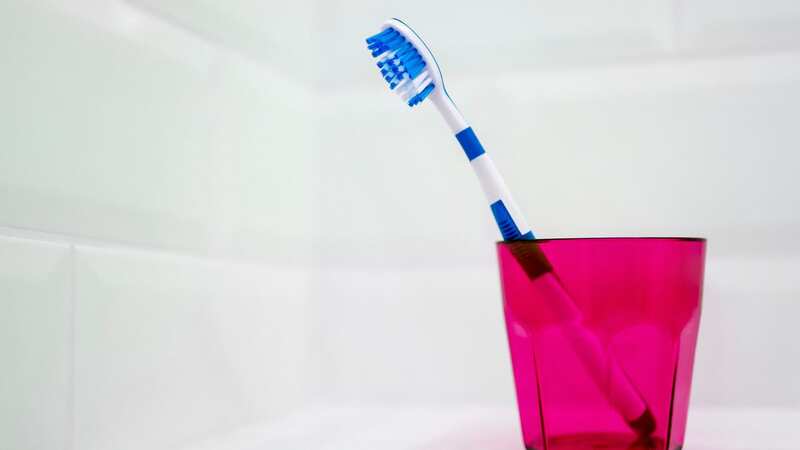 A dentist has suggested that storing your toothbrush in the bathroom could be unhygienic (Stock Image) (Image: Getty Images)