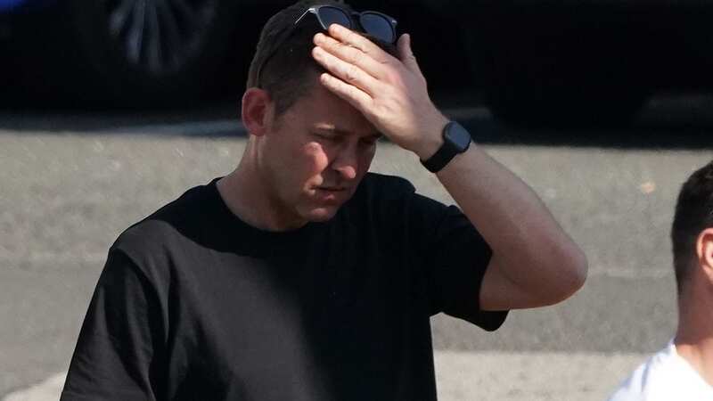 Scott Mills clutches his head as he leaves Calvin Harris and Vick Hope