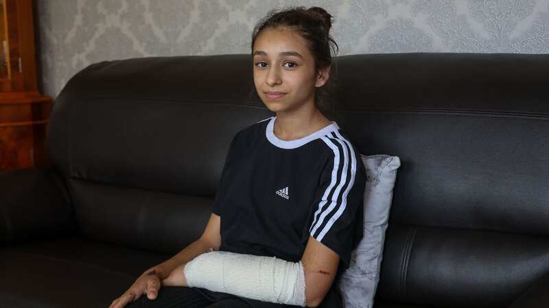 Ana Paun with her arm bandaged after being attacked by the American XL Bully dog in Birmingham (Image: Anita Maric / SWNS)