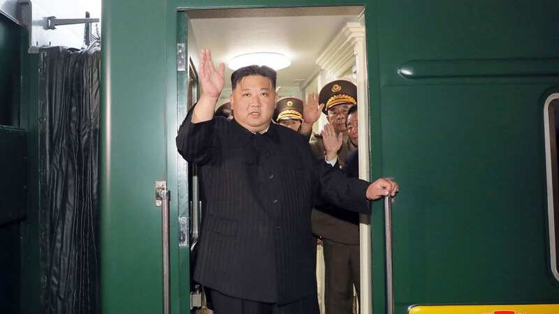 Kim Jong-Un waves as he departs from the North Korean capital Pyongyang on Sunday (Image: KCNA VIA KNS/AFP via Getty Image)