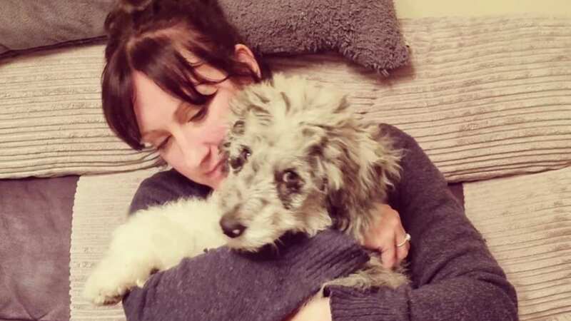 Jodie Young pictured with her beloved dog Merlin