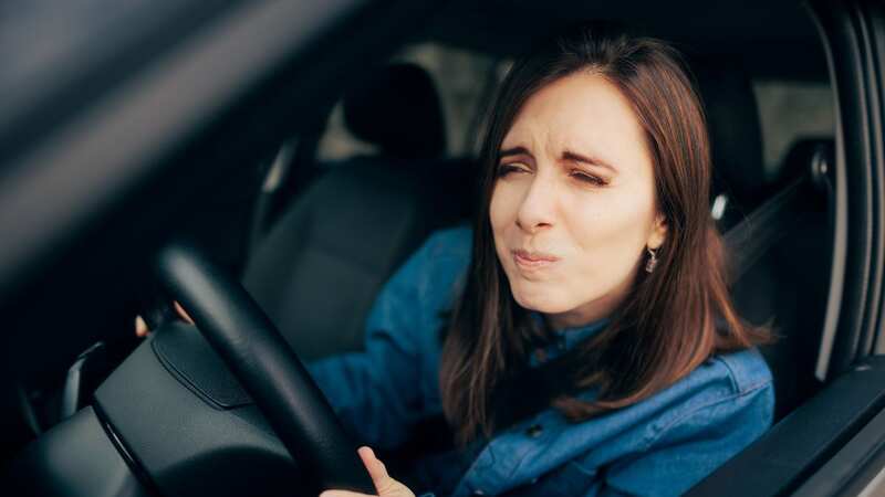 Experts have warned water left in a hot car could make drivers sick if they consume it (Image: Getty Images)
