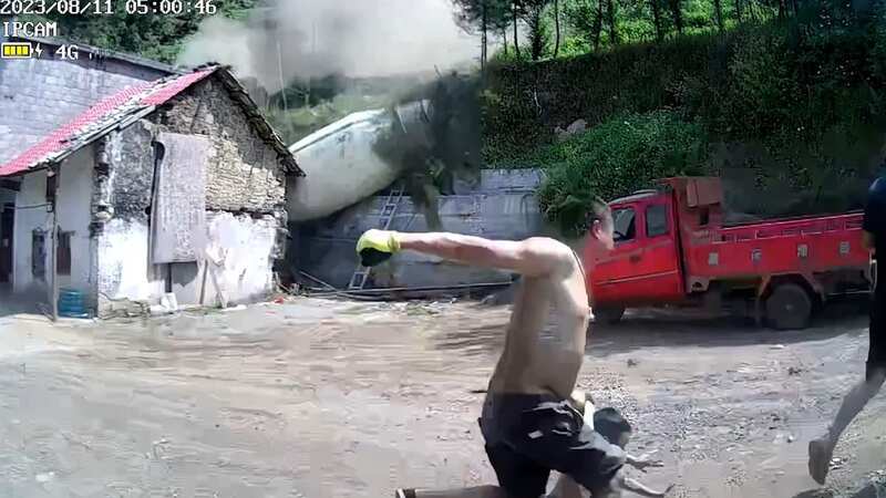 Moment father and son narrowly escape cement tanker ploughing into building