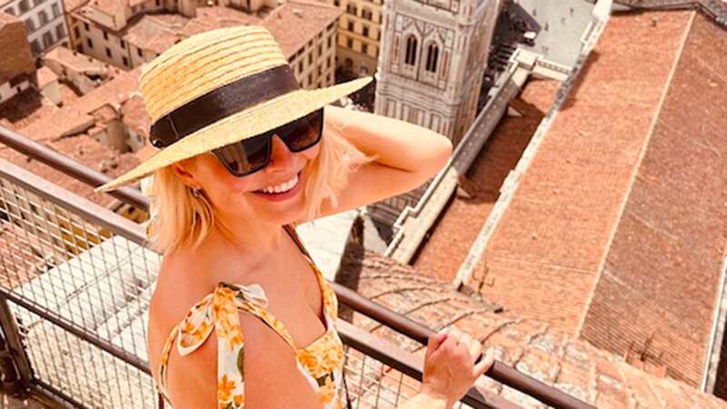 Holly Willoughby is all smiles as Phillip Schofield 
