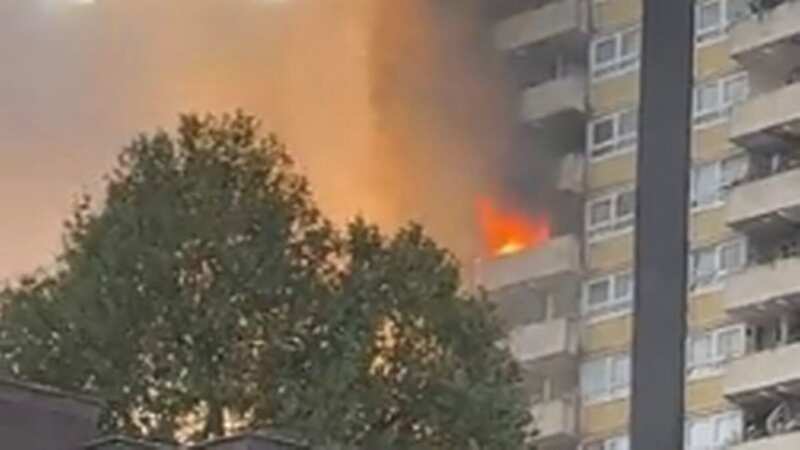Flames and smoke billow out of block of flats in Kilburn with 
