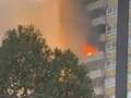 Flames and smoke billow out of block of flats in Kilburn with 'explosions' heard
