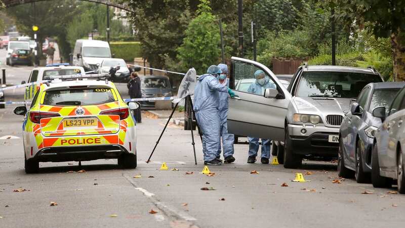 Forensic officers are pictured at the crime scene in North London (Image: Dinendra Haria/LNP)