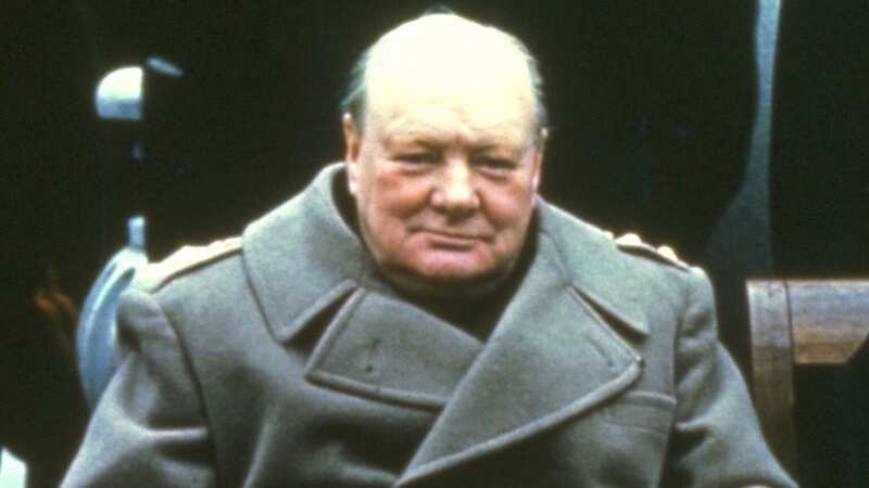 Winston Churchill sitting in a 