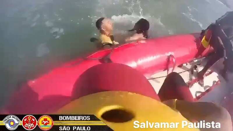 Terrifying moment lifeguards pluck teen from raging sea as boyfriend swept away