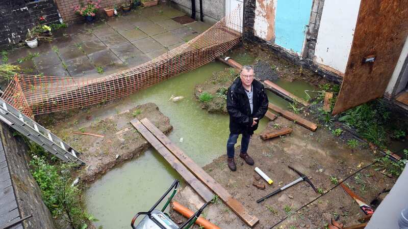 Chris Bowden, 60, discovered an active mains water pipe running under the back of his home (Image: WalesOnline/Rob Browne)