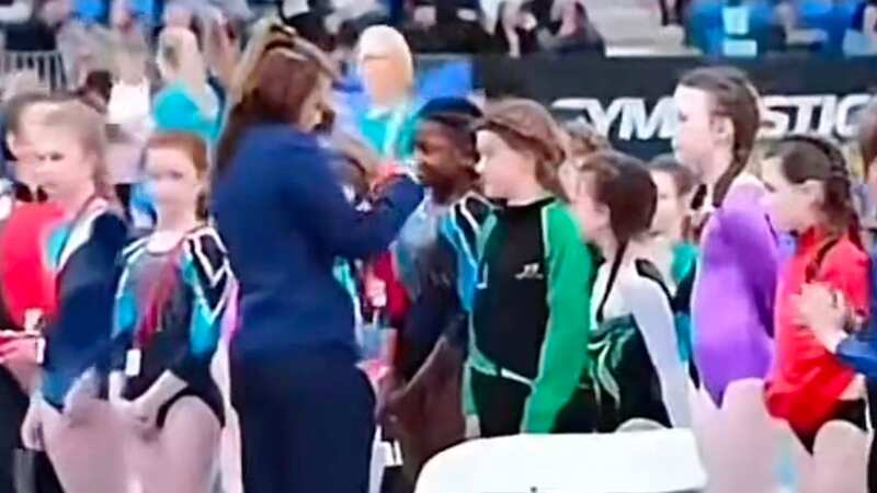The young girl appeared excited to receive her medal