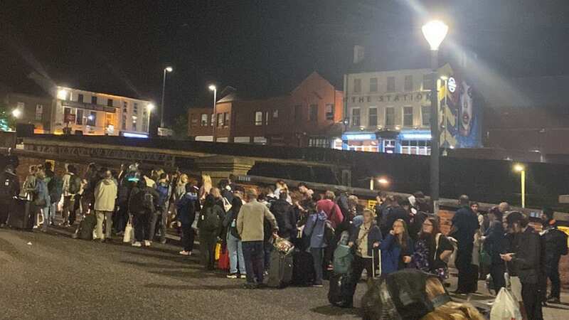 Passengers waiting for taxis to take then nearly 200 miles to Edinburgh from Preston (Image: @JamesNokise/Twitter)