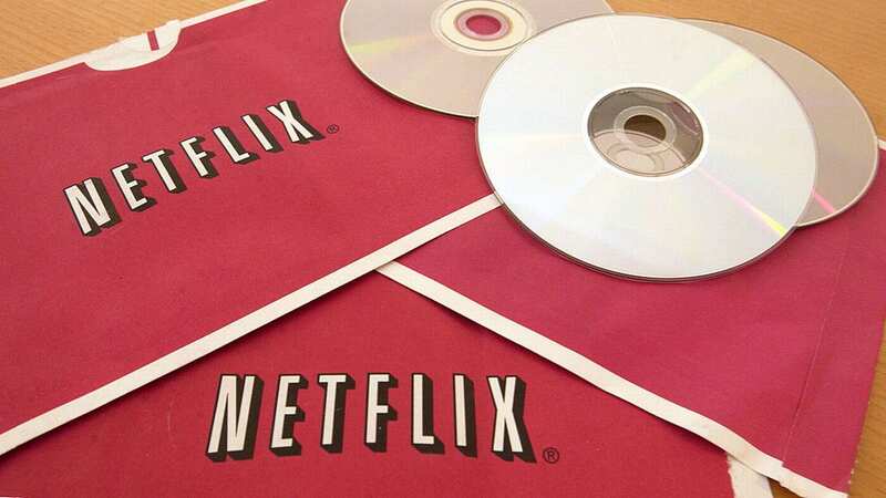 Netflix DVDs are sent to subscribers in these iconic red envelopes - which became very familiar to your postie! (Image: Bloomberg via Getty Images)