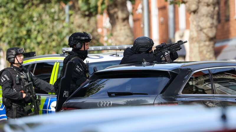 Armed police have surrounded a property in Birmingham (Image: SWNS)