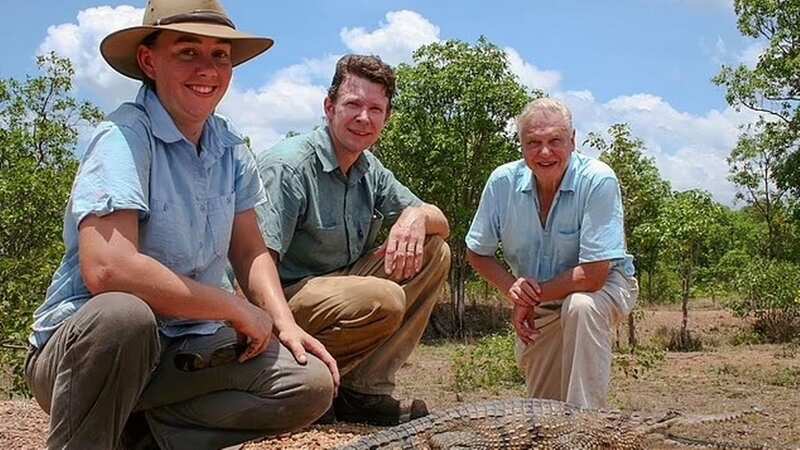 Adam Britton (centre) with his wife Erin (left) and David Attenborough (right) during filming for a BBC documentary