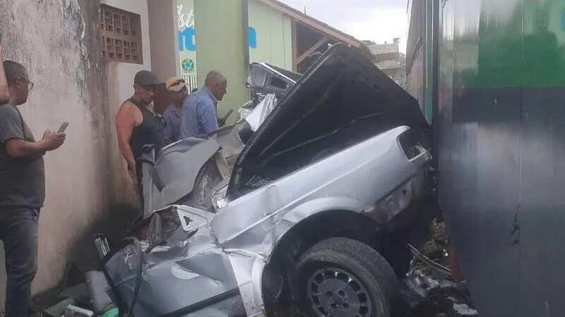 Moment train smashes car into mangled wreck at railway crossing as driver dies
