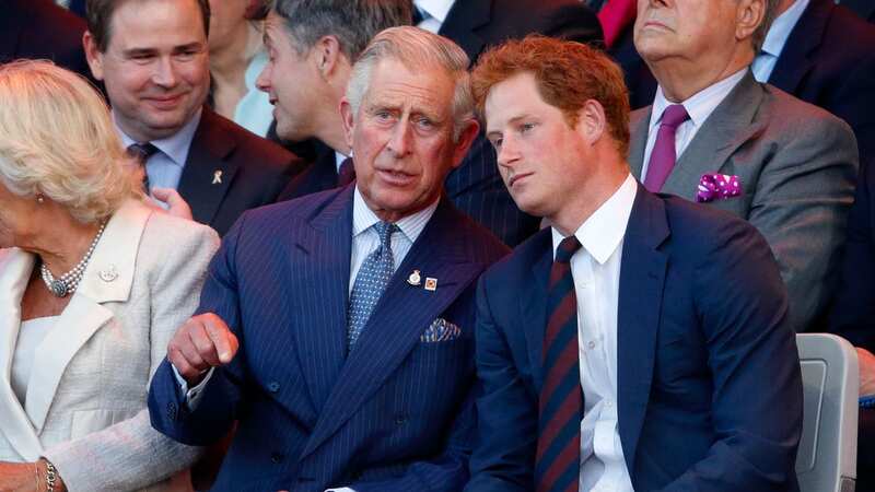 Prince Harry with his father in 2014 (Image: Getty Images)