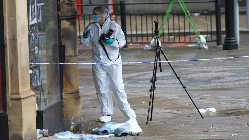 Forensic officers at the scene (Image: Lee McLean/SWNS)