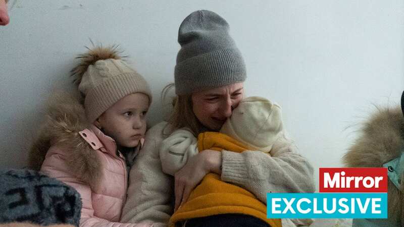 A woman whose husband was killed in the shelling cries on the floor of a corridor in a hospital in Mariupol (Image: AP)
