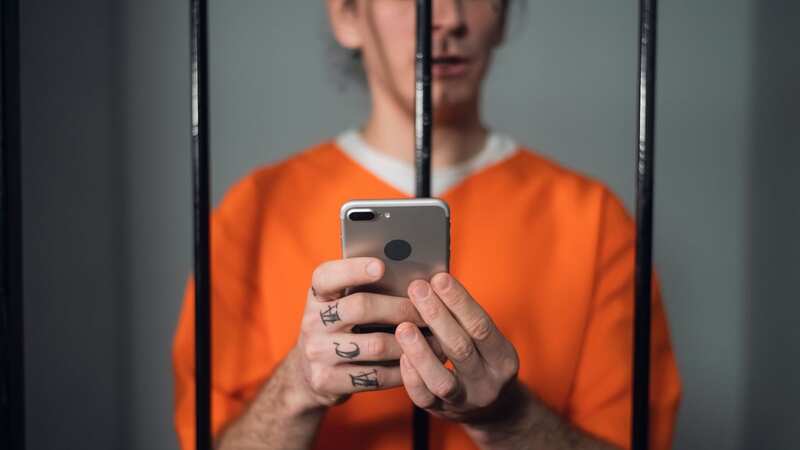 Inmates are prohibited from having phones with them in their cells (Image: Getty Images/iStockphoto)