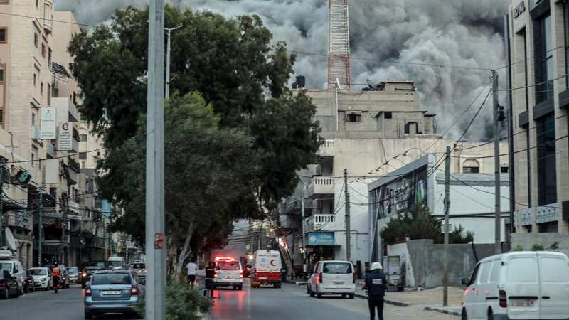 Smoke rises after Israeli warplanes targeted the Palestine tower in Gaza City following attacks from Hamas militants in Israel