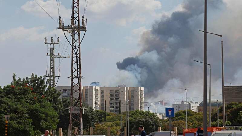 Smoke billows in Ashkelon as barrages of rockets were fired from the Palestinian enclave into Israeli territory (Image: AFP via Getty Images)