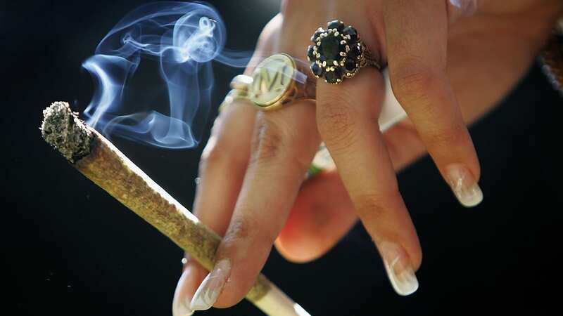 A girl smokes a joint (Image: Getty)