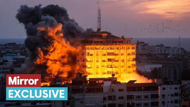 Smoke rises over buildings in Gaza City following an Israeli air strike (Image: Sameh Rahmi/NurPhoto/REX/Shutterstock)