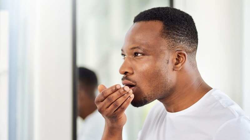 There are ways you can stop your breath from smelling so badly in the morning (stock photo) (Image: Getty Images)