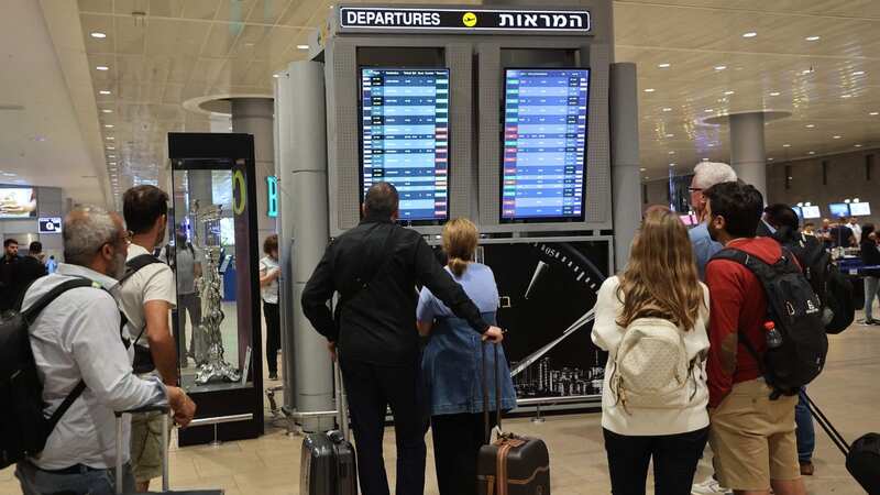 Major airlines have cancelled flights to Israel, with many people now stuck trying to find a way out of the country as violence breaks out (Image: AFP via Getty Images)