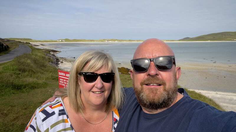 Greg Crawford and his wife Julie on their trip to the island of Barra in the Outer Hebrides (Image: Greg Crawford / SWNS)