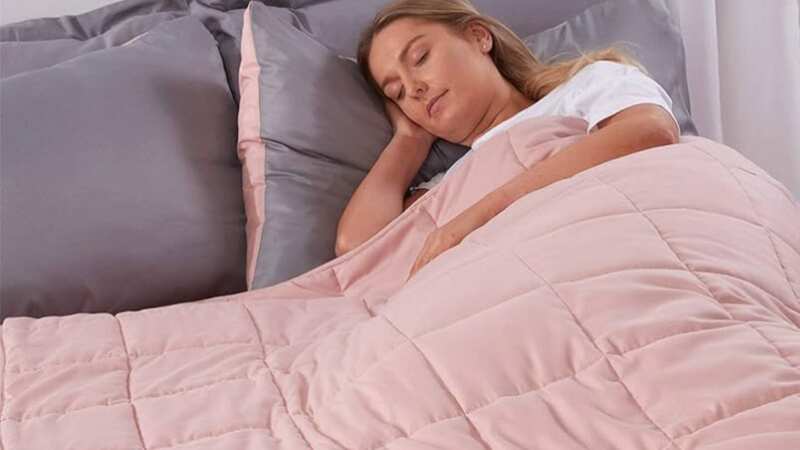 Improve your sleep with a warm and cosy weighted blanket (Image: Amazon)