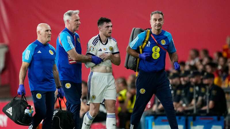 Liverpool handed Robertson scare as Scotland skipper forced off with injury