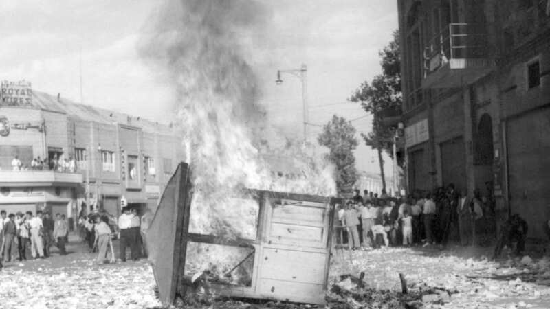 A Communist newspaper kiosk burned by pro-shah demonstrators after the coup d