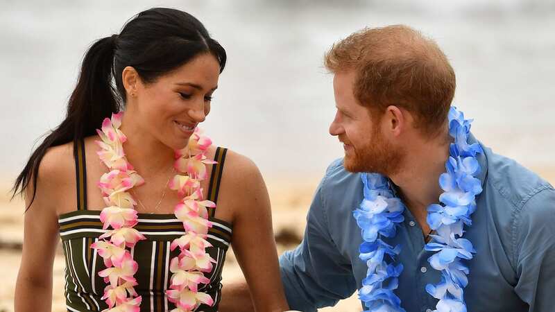 Meghan Markle dazzles in £5,400 beach dress during lavish Caribbean trip