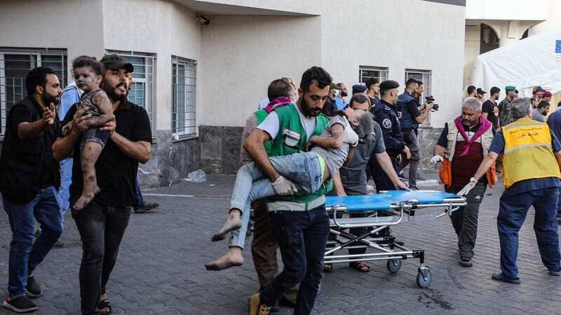 Children injured in an Israeli strike are rushed to the Al-Shifa hospital in Gaza City (Image: AFP via Getty Images)